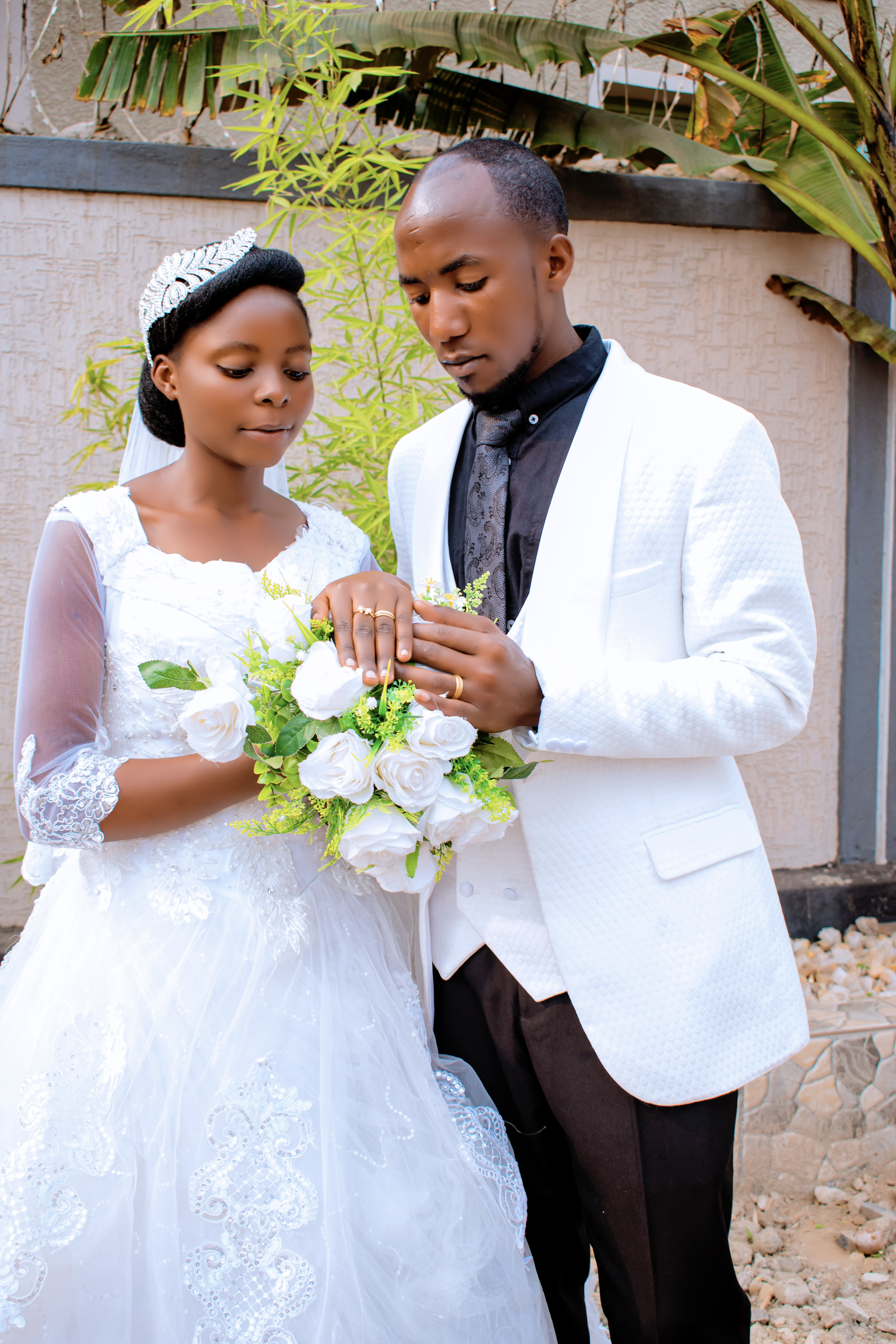 Couple photographed at golden hour beside Lake Kivu during a wedding shoot in Rubavu